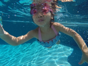Madee- Age 4 She worked hard all summer to swim across the pool. Here she is achieving that goal! GO MADEE GO!